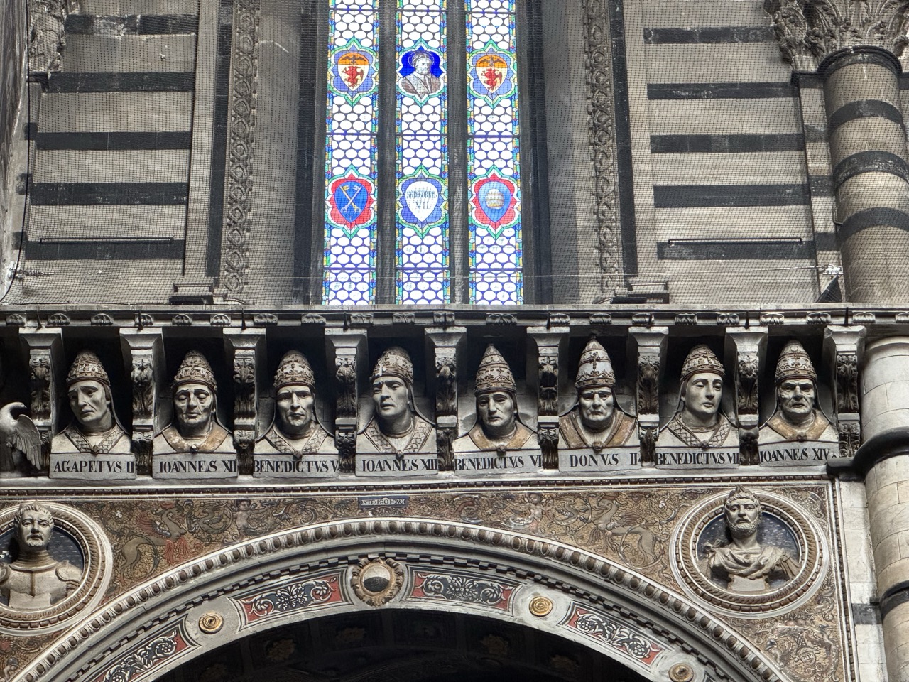 Heads of saints (?) watching