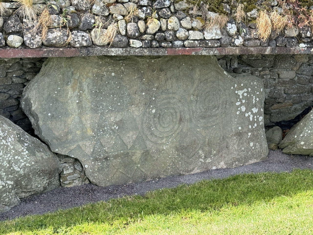 Closer view of swirls carved into rock at Newgrange